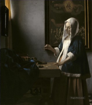 Mujer sosteniendo una balanza barroca Johannes Vermeer Pinturas al óleo